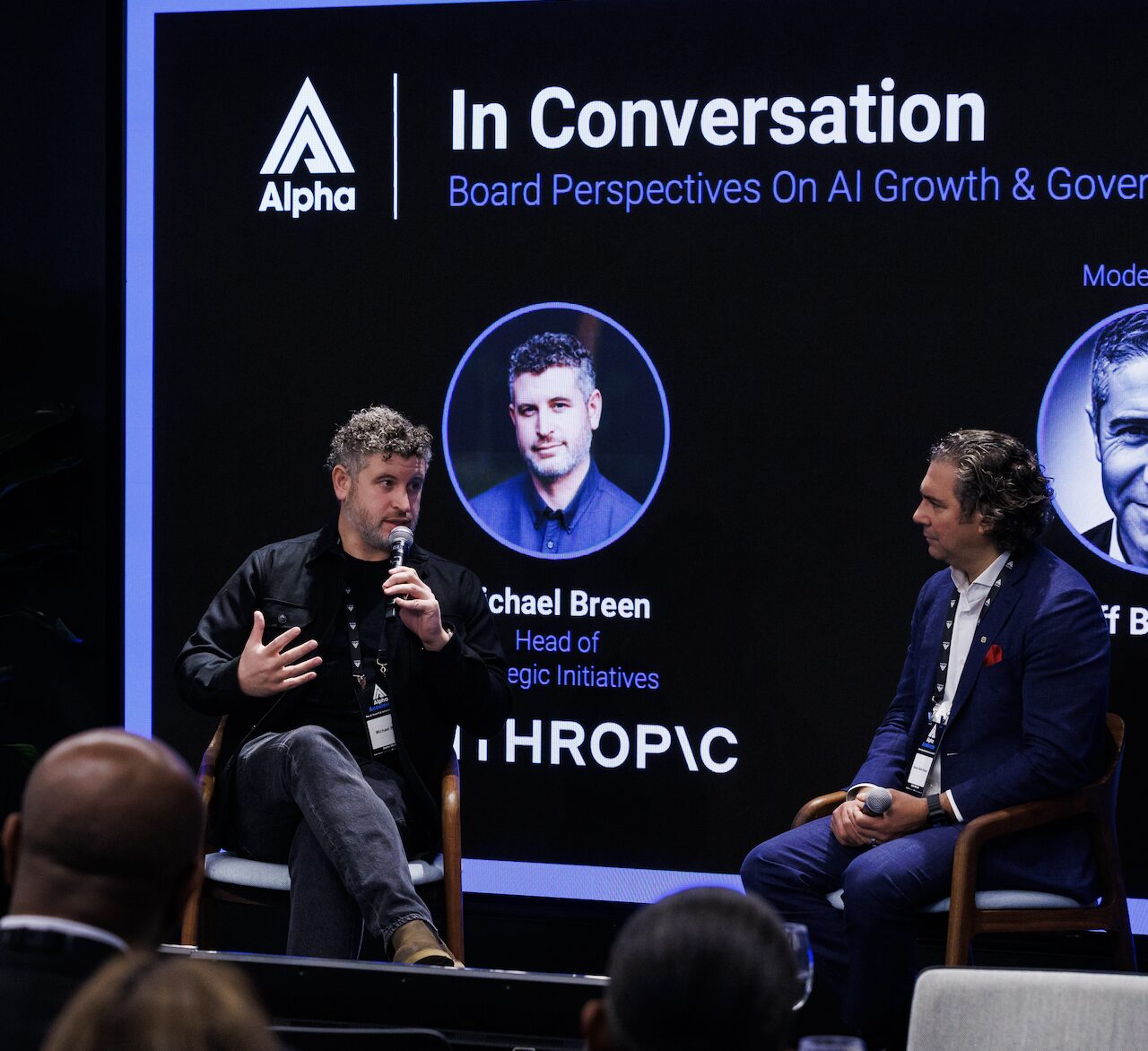 Two panelists seated onstage during an Alpha In Conversation session.